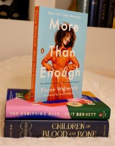 Elaine Welteroth's book, More Than Enough, standing on top of two other books. 